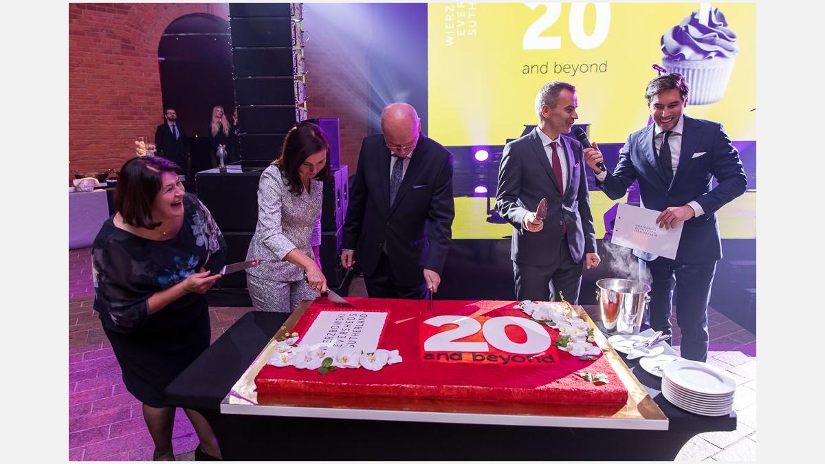 1 The partners and the anniversary cake