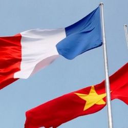 French and Vietnamese flags flying