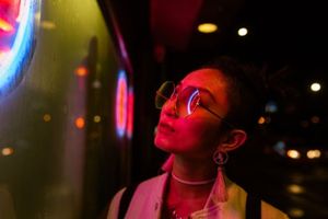 Woman looking at Neon Sign 