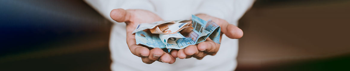 image of hands holding dollars